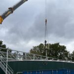 A Jongia type LB agitator hangs from a mobile crane above the bridge on the sludge mixing tank at WWTP Venlo.